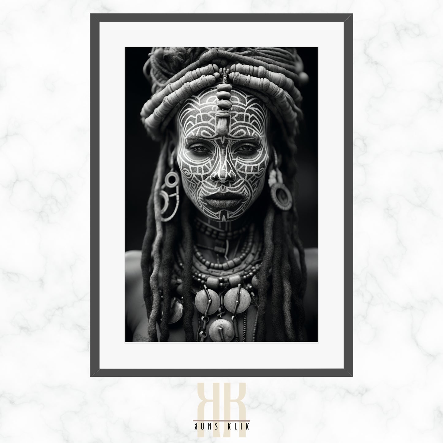 A monochrome portrait of an individual with traditional facial markings and adorned with tribal jewelry, including a headdress, earrings, and necklaces. The person is gazing directly at the camera with a neutral expression.